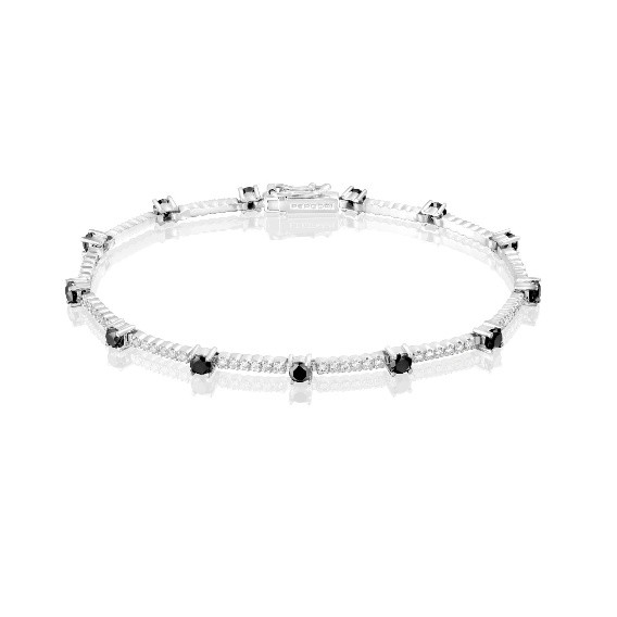 Joyas imprescindibles en tu joyero Pulsera de oro blanco con diamantes negros y diamantes blancos engastados en diseño alternado, estilo elegante y moderno.