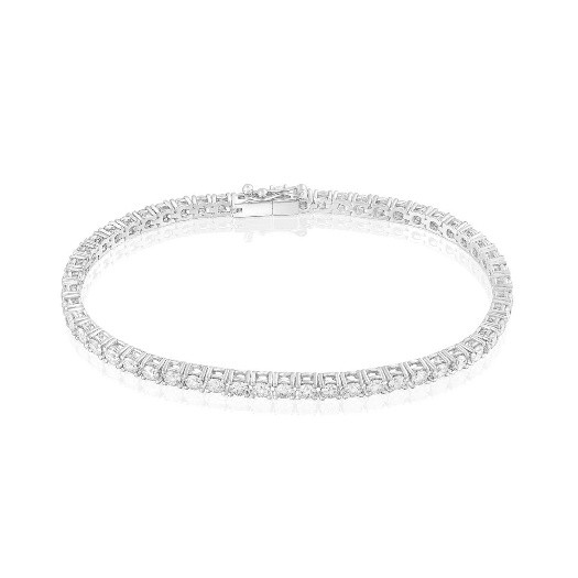 Joyas imprescindibles en tu joyero Pulsera de oro blanco con diamantes talla baguette y brillante en patrón geométrico, estilo refinado y lujoso.